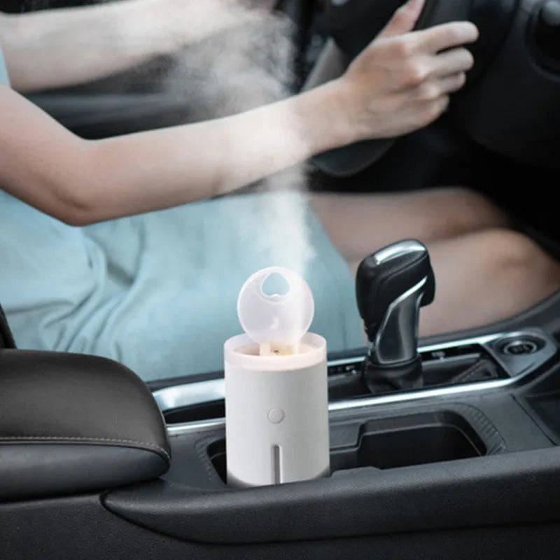 Porcelain white desktop humidifier with lamp showing 360ml water tank and compact design