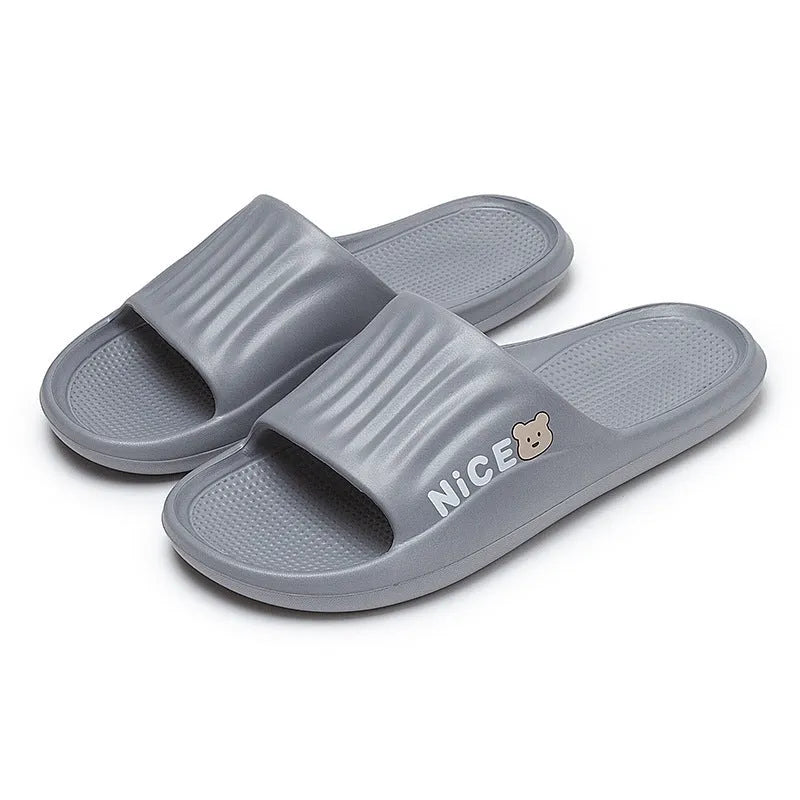 Adult unisex EVA cartoon pattern flip flop slippers in black, shown from above.