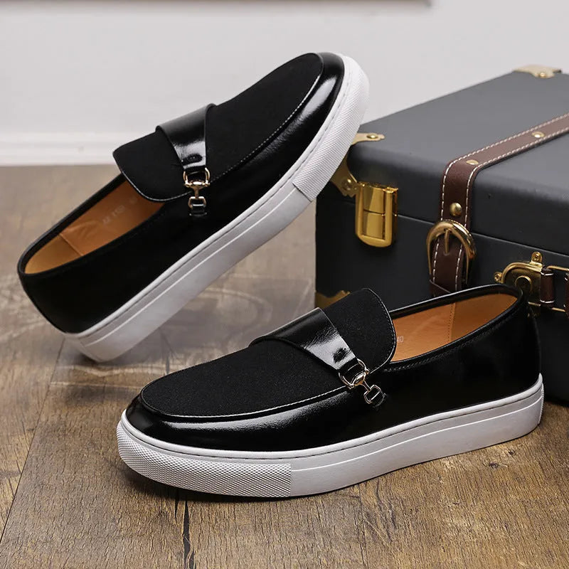 Men's black faux leather slip-on loafers featuring a gold horsebit buckle and a round toe.