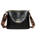 Large capacity multi compartment cross body bag in brown PU with sandwich pocket and sewing thread detail