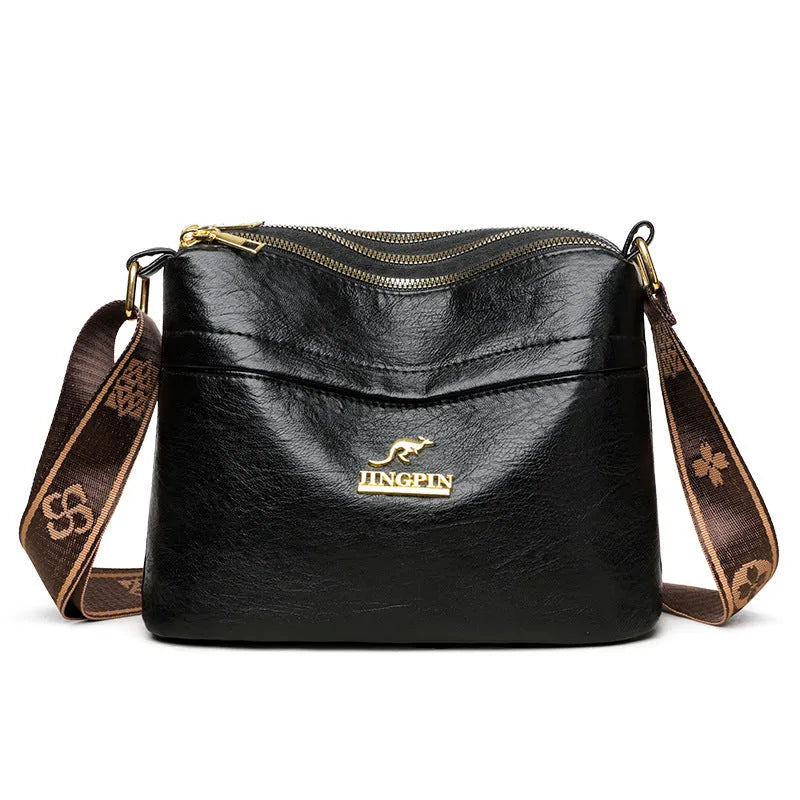 Large capacity multi compartment cross body bag in brown PU with sandwich pocket and sewing thread detail