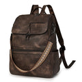 Retro solid colour PU backpack with curved shoulder straps shown in black.