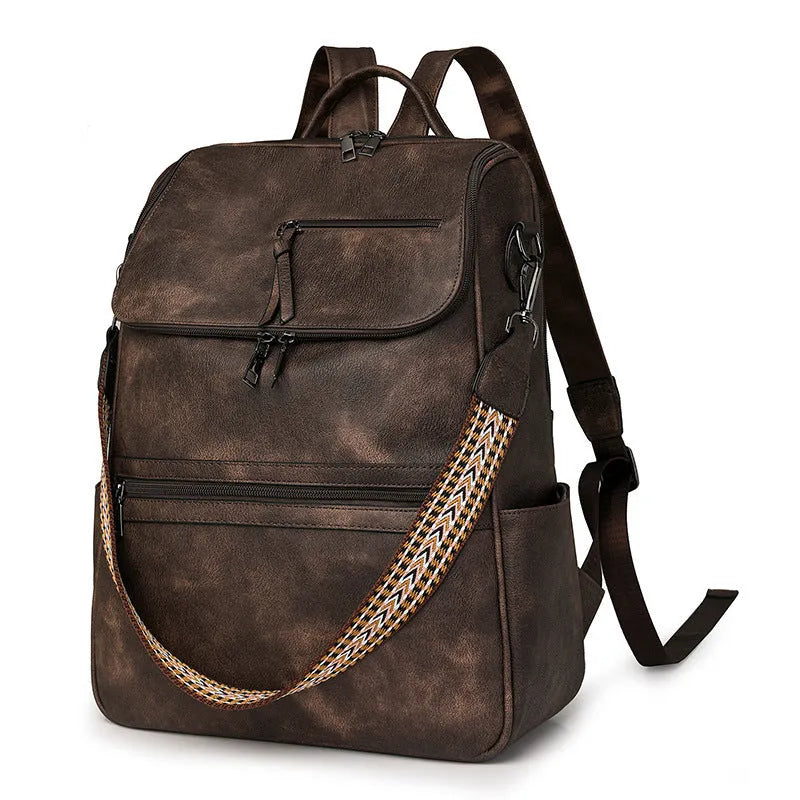 Retro solid colour PU backpack with curved shoulder straps shown in black.