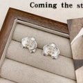 Retro floral earrings for women in gold and silver colours with petal design