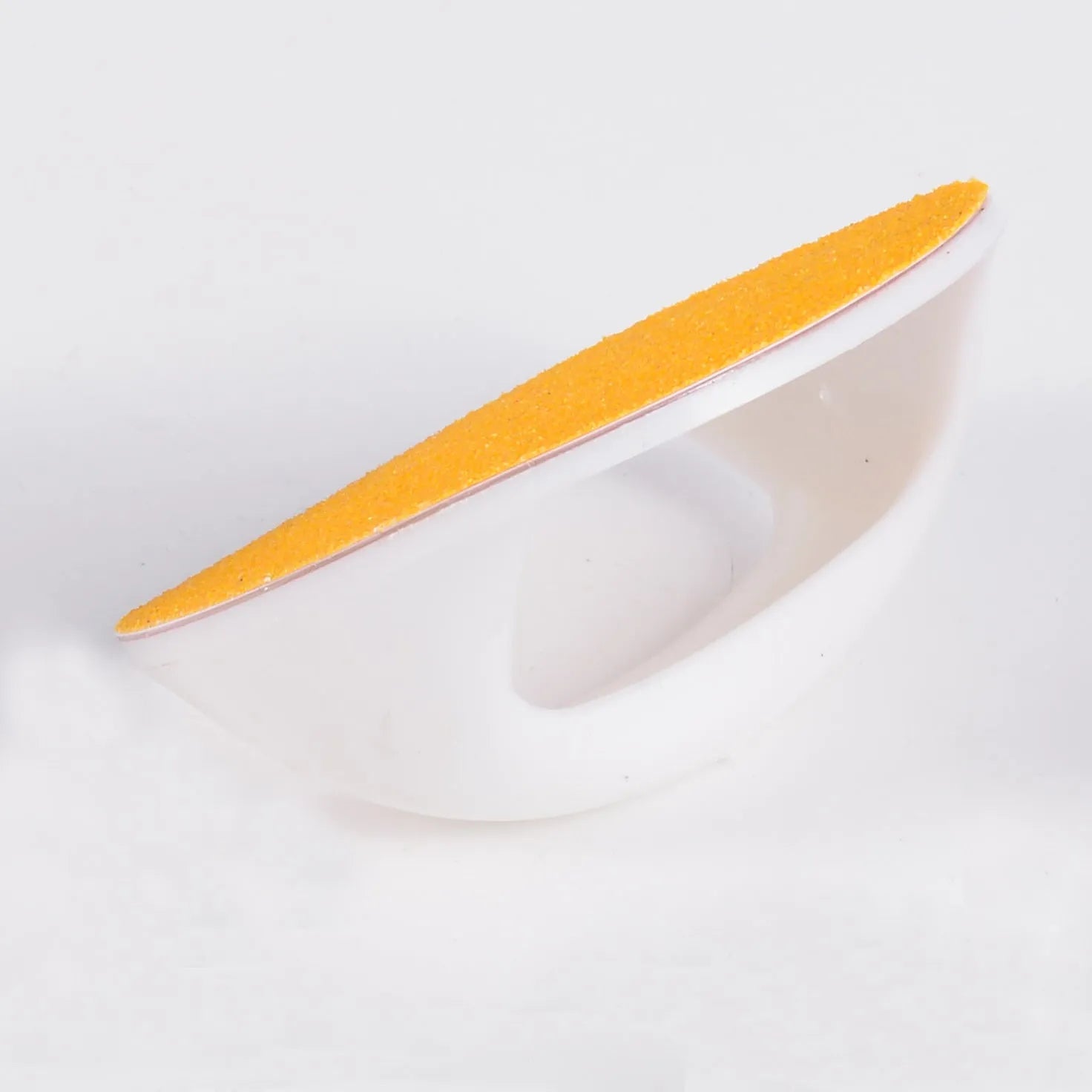 Square dog nail file with ergonomic handle in blue colour on a table