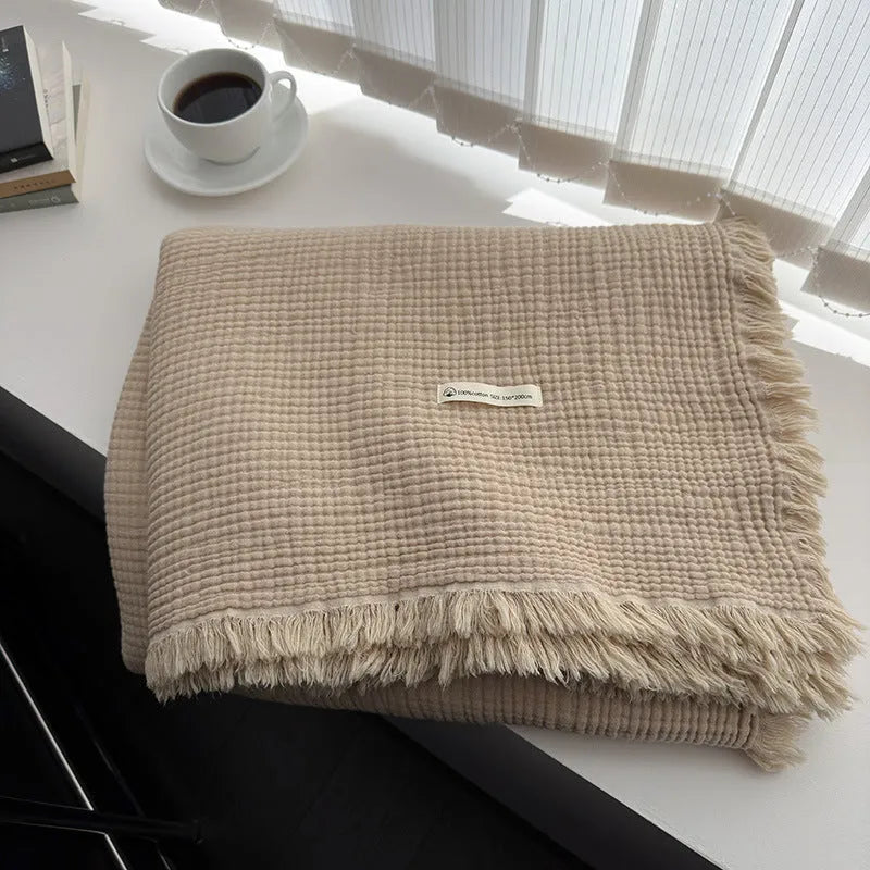 Four-layer cotton gauze blanket with tassel trim in navy blue colour