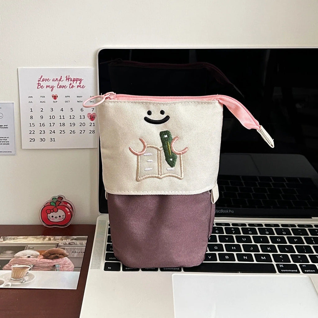 Cartoon Korean style collapsible pencil case in Oxford fabric measuring 17x14cm