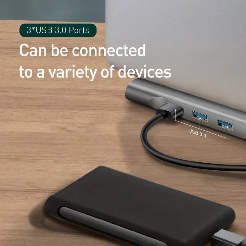 Grey aluminium ten-port laptop docking station with cooling bracket showing HDMI, VGA and USB connections