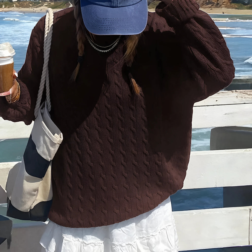 Solid colour long-sleeved viscose knitwear in brown, navy blue, and burgundy on a plain background