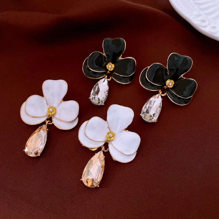 Floral pendant earrings in alloy with dripping oil finish, silver needle posts, Golden-white or Golden-black