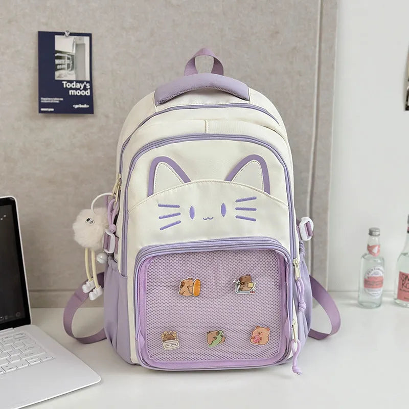 Korean cartoon backpack in multiple colours with curved shoulder straps and badge pendant options