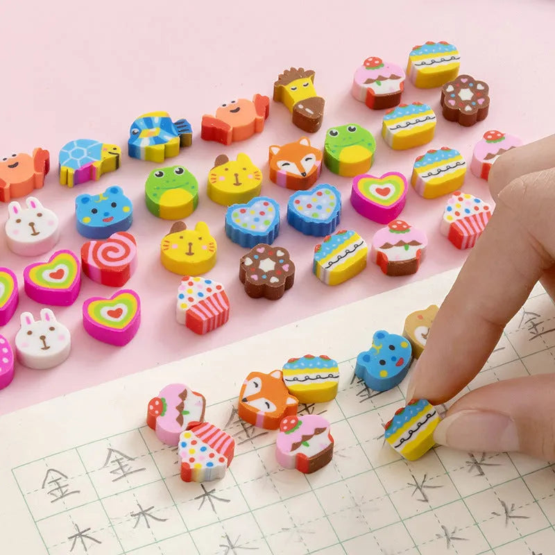 Sealed plastic bag containing 50 small cartoon-themed erasers in shapes like fruits, animals, and Christmas symbols.