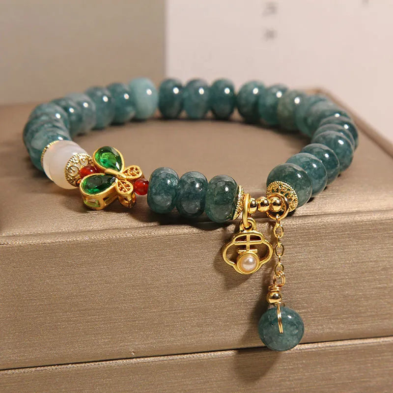 Blue jade abacus beads crystal bracelet with alloy inlay, rhinestone accents, butterfly charms and white agate beads