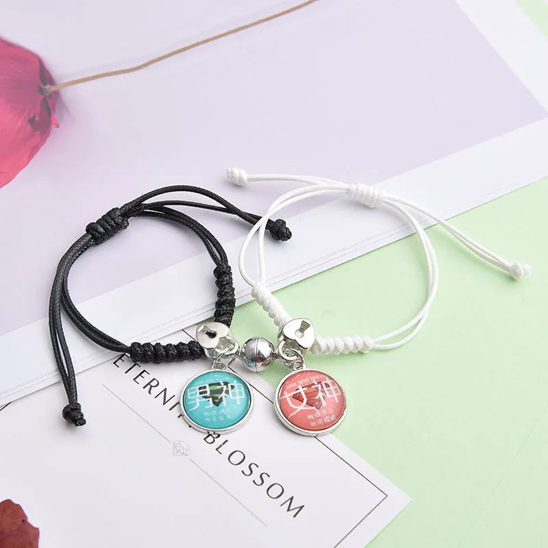 Magnet suction couple bracelets with alloy construction and various pendant designs including crowns and hearts