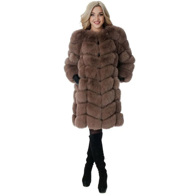 Women's long artificial fur coat in a range of colours on a hanger.