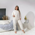 Women's creamy white plush two-piece casual set with crew neck top and trousers
