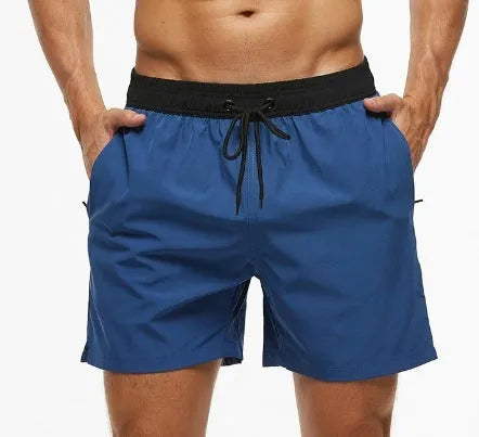 Men's blue fitness shorts with a drawstring waistband and a side zipper pocket.