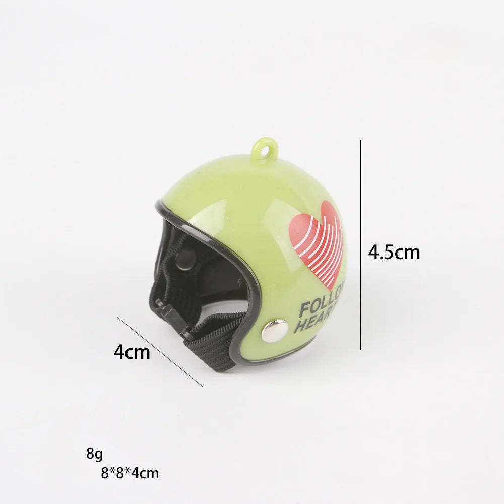 Small hard plastic pet helmet with elastic straps, shown on a chicken.