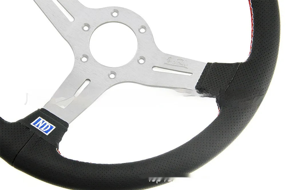 Leather 14-inch steering wheel with a concave rim profile and three-spoke design on a black background.