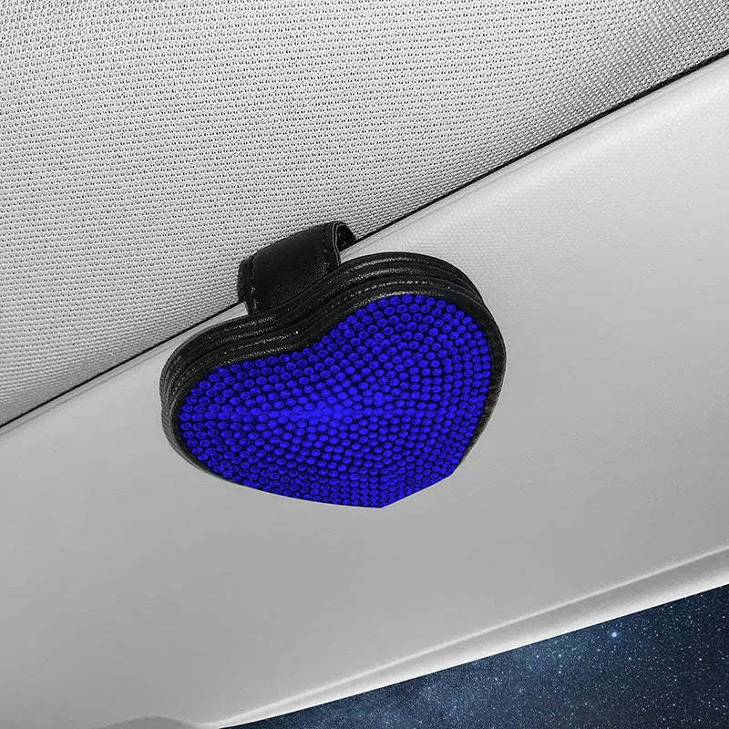 Black PU leather magnetic storage clip with diamond encrustment, shown attached to a car sun visor.