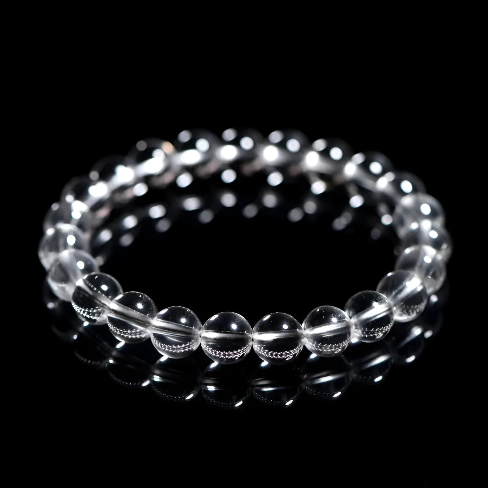 Natural Donghai white crystal round bead geometric bracelet on a wrist.