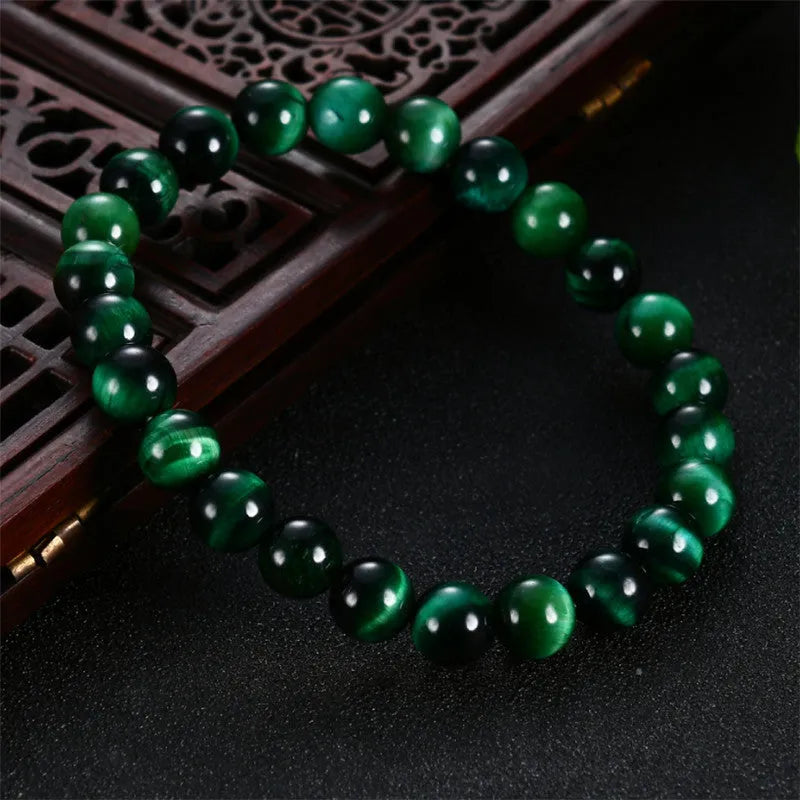 Green tiger eye stone bracelet with polished geometry beads showing five size options