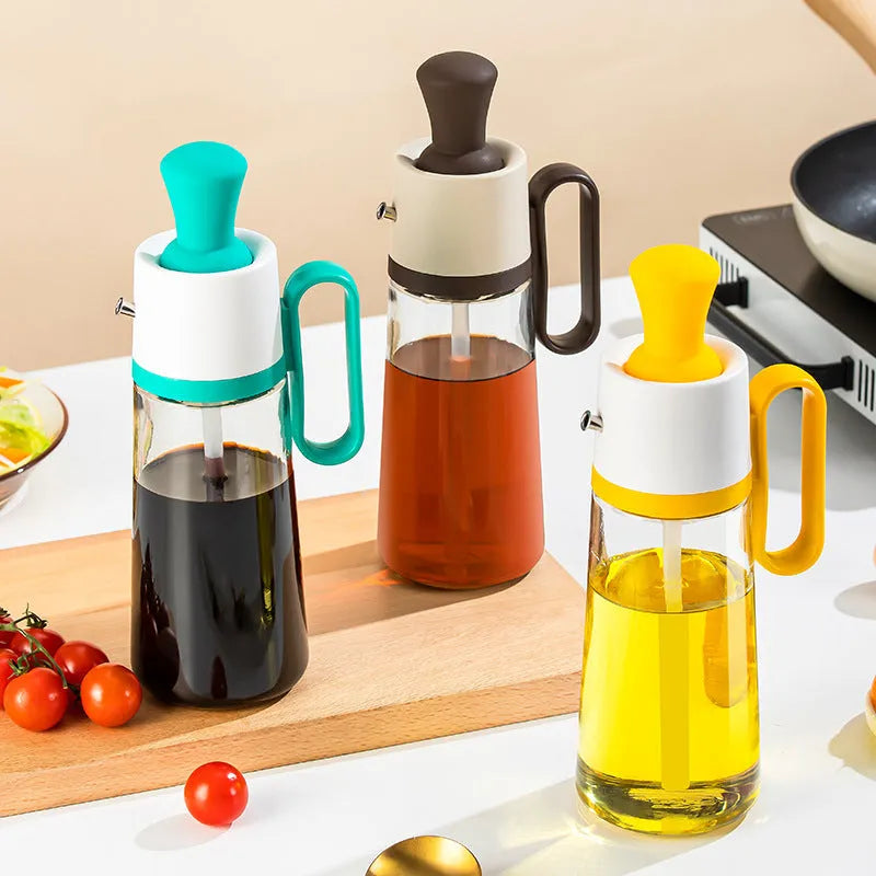 Transparent glass oil dispenser with silicone brush, stainless steel nozzle, in yellow, green, or brown.