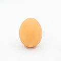 Red rubber egg-shaped dog chew toy with squeaker sound mechanism for dental care and interactive play.