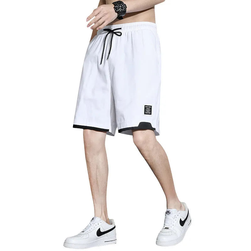 Boys' cotton shorts in black, khaki, or white, showing mid-waist and shorts length design.