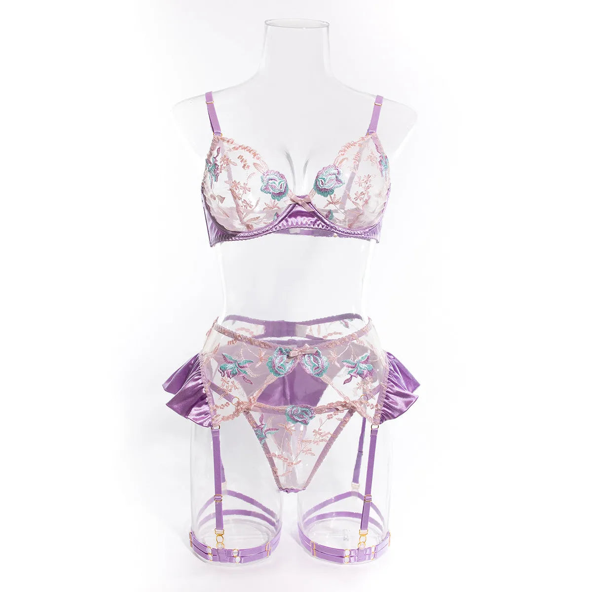 Light purple satin lingerie four-piece set with decorative embroidery on a hanger
