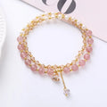 Close-up of a freshwater pearl and crystal double ring bracelet with a sliding bead closure.