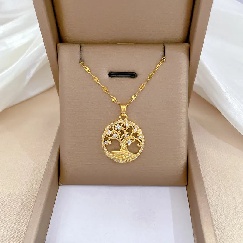 Gold-plated necklace with mother of pearl cross pendant and micro-inlaid rhinestones on a lip chain.
