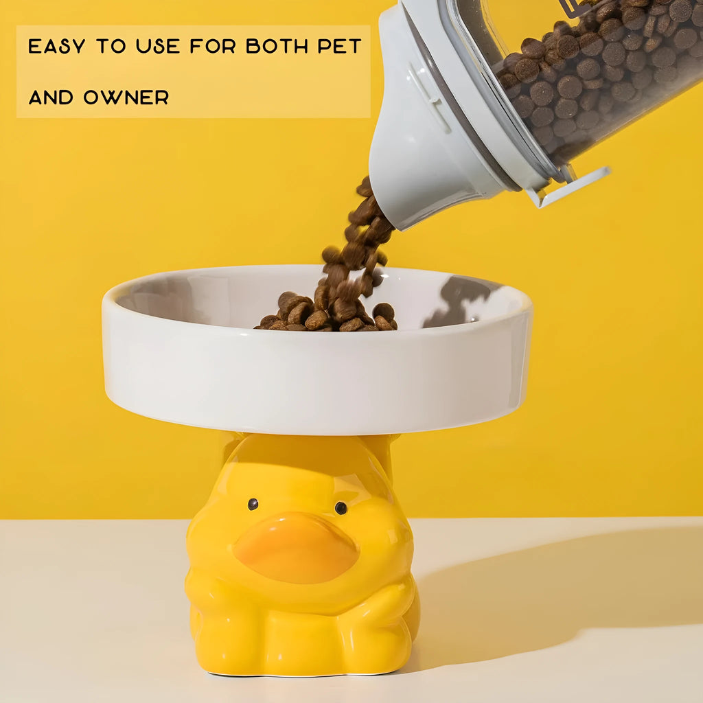 Raised ceramic pet bowl in animal design, showing wide shallow dish on elevated base.