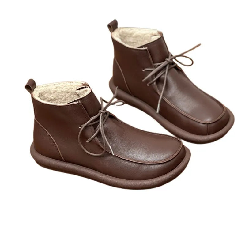 Women's black cowhide boots with flat heel and round toe, showing 9cm sock length