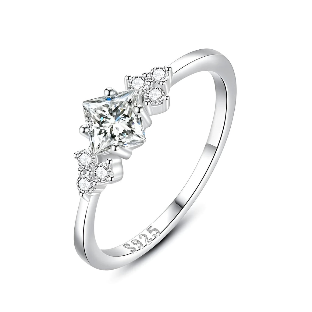 S925 silver ring with rhombus-shaped gold-plated setting and artificial gem on white background