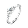 S925 silver ring with rhombus-shaped gold-plated setting and artificial gem on white background