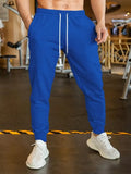 Men's linen-coloured leisure trousers with a loose fit and drawstring waist.