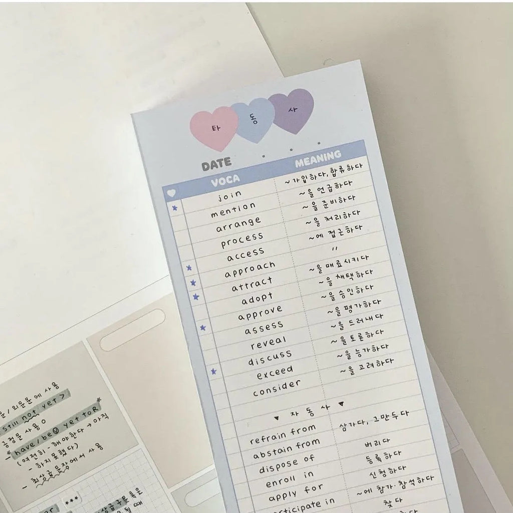 Vertical English word notepad in blue, pink, or purple cover, showing double-sided printed pages.