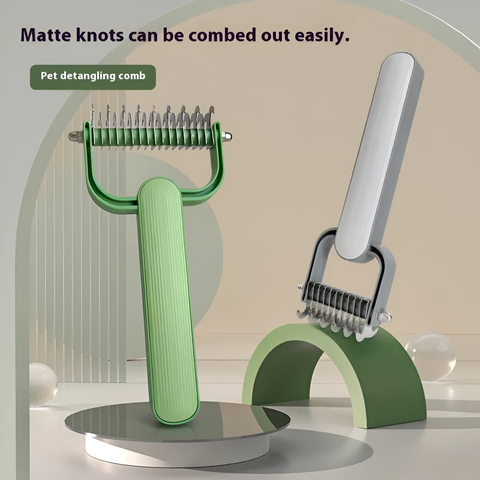 Green and grey dog unknotting combs in large and small sizes with stainless steel teeth.