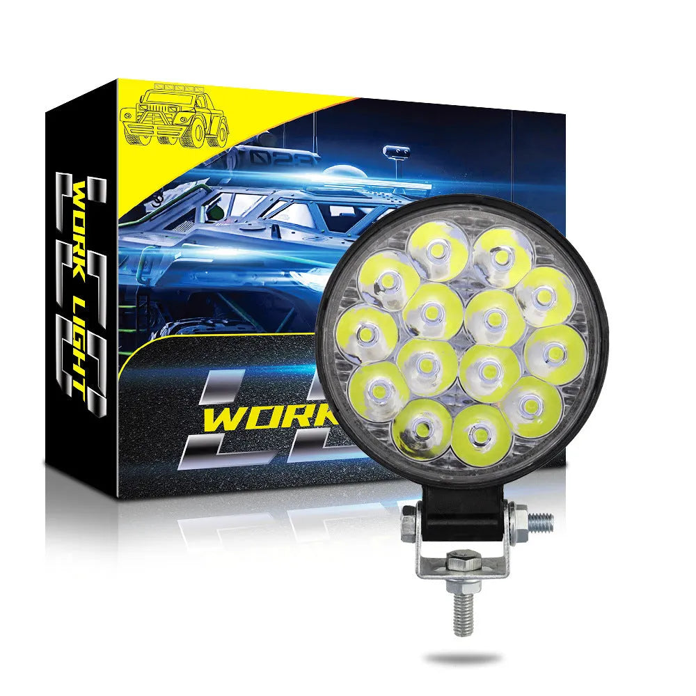 Compact round aluminium car LED work light with IP67 waterproof rating and 6000K white light output.