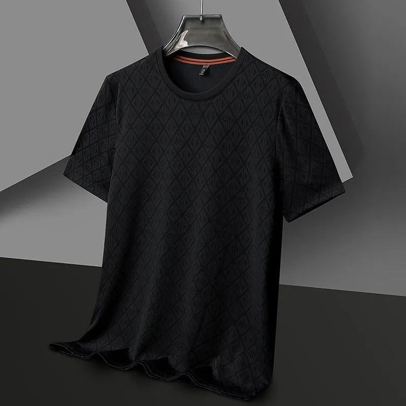 Man wearing a solid colour loose-fit Jacquard pattern short sleeve t-shirt for casual leisure.