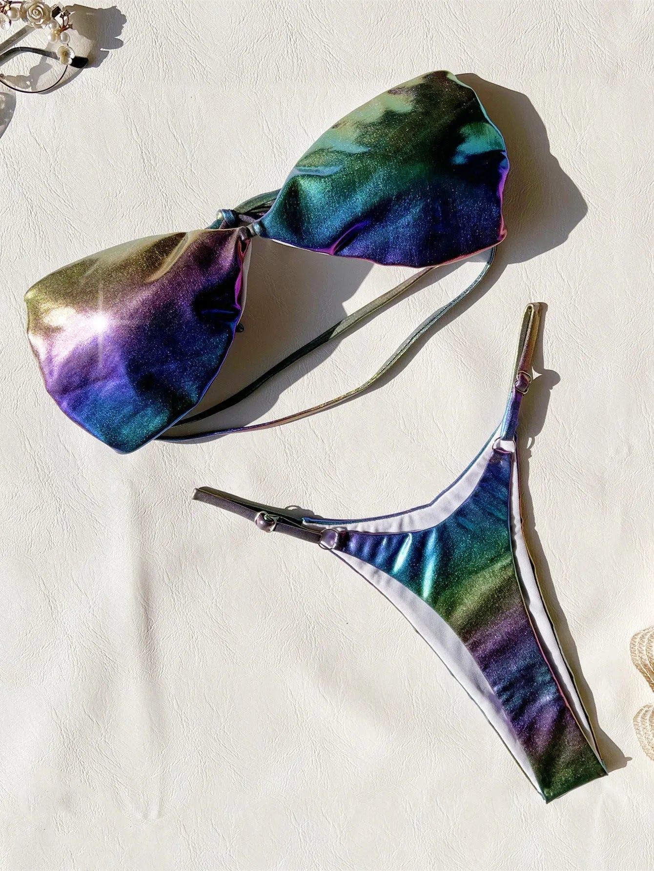 Women's gradient purple bikini swimsuit on a mannequin, showing the two-piece design.