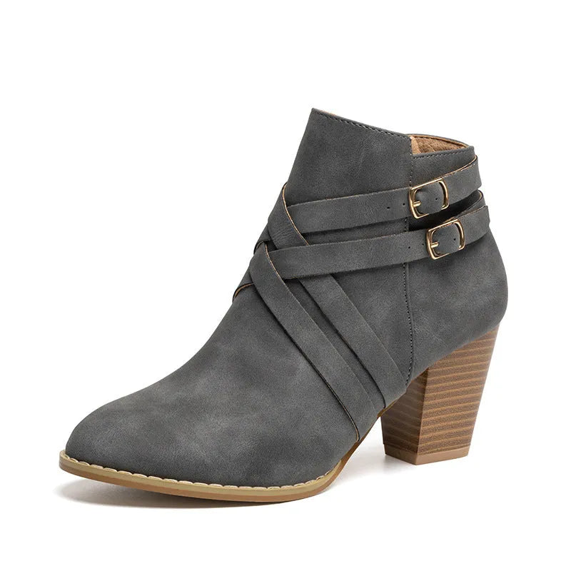 Plus size black short boot with side zipper, belt buckle, and a 7cm rubber heel