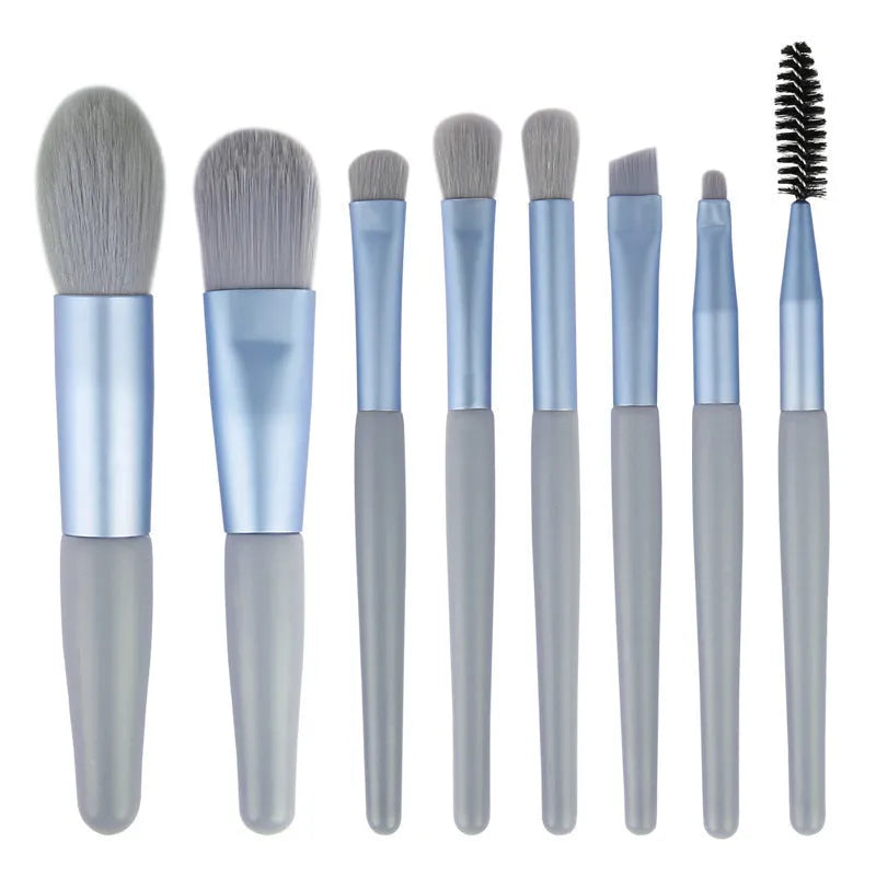 8-piece Morandi makeup brush set with fibre hair bristles in pink, blue, apricot, and green on a light background