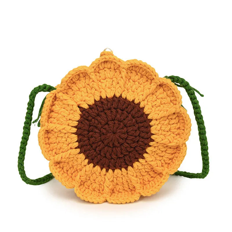 Hand-woven wool bag with crocheted flowers in round shape showing cotton lining and phone pocket