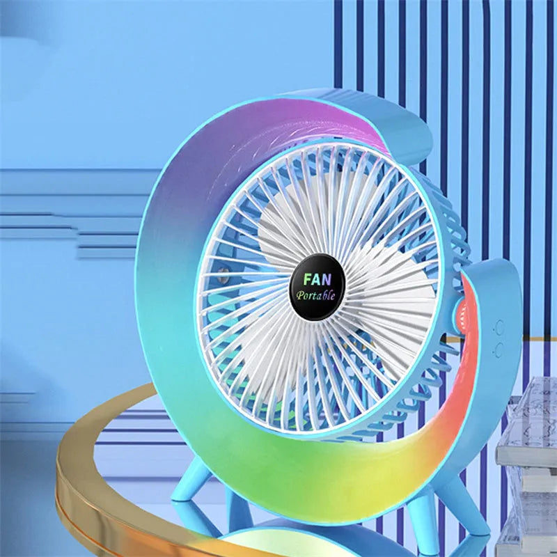 Desktop mini fan with night light in grass green showing 180-degree tilt and USB port