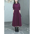 Purplish red plus size long dress with extra long sleeves for autumn and winter wear.
