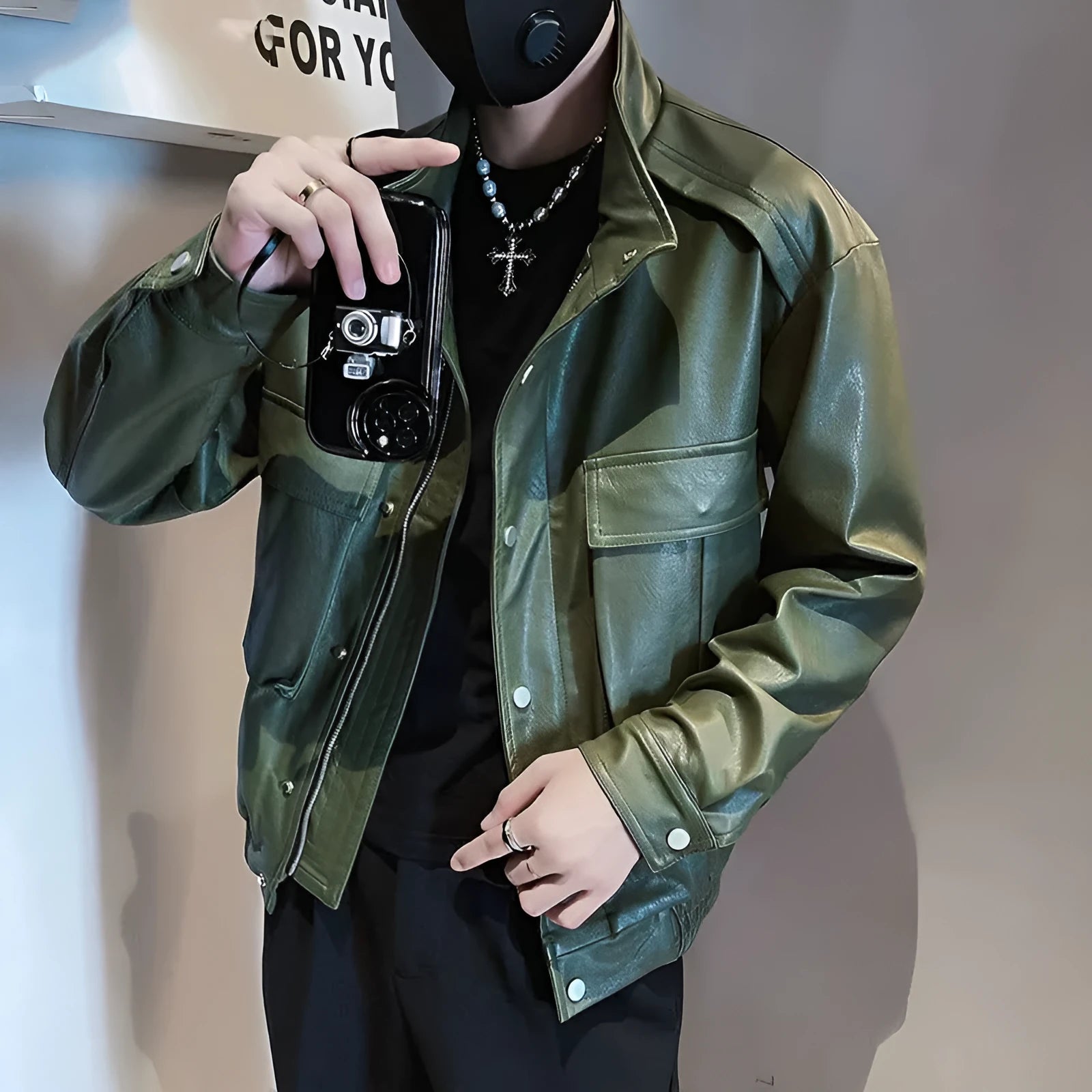 Men's black Korean-style PU leather pilot jacket with side pockets on a hanger.