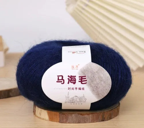 Ball of mohair yarn for DIY scarf knitting in one of 34 colours, including white, pink, blue, and green.