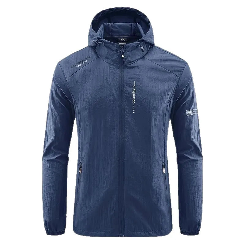 Man wearing a light grey loose-fit hooded nylon summer jacket outdoors.